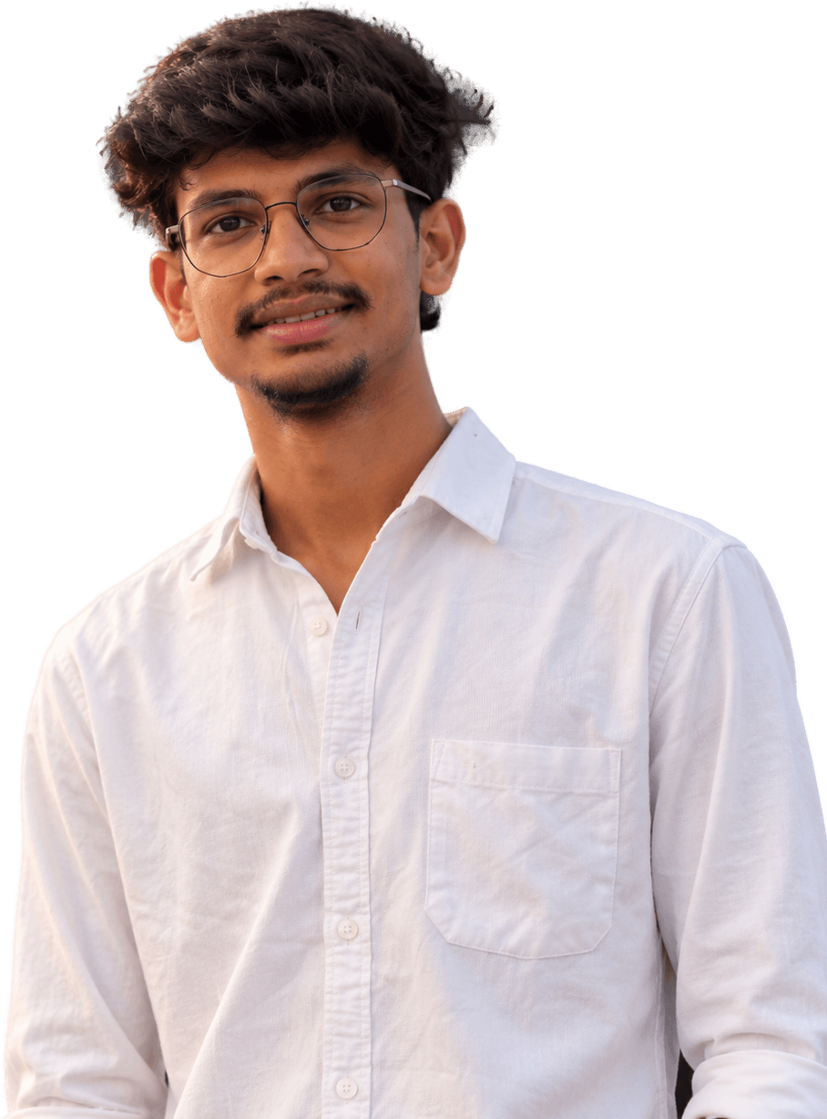 Sunil Sambangi in a white shirt and glasses, smiling